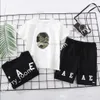 designer kids clothing sets fashion summer boys girls cartoon head camouflage printed shorts sleeve Tee Tops and casual shorts children sports outfits C7006