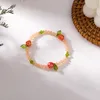 Braccialetti di collegamento Catena Corea Prodotti primaverili Colore carino Frutta Perline Braccialetto di corda elastica Ragazza Cristallo per donnaLink Raym22