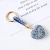 Keychains de diamante pêssego Chave de chaves de feminina de fúria pingente de moda festiva Keyring