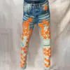 Jeans da uomo Homme Marque De Luxe Orange Star Patchwork in pelle Jean Hole Repair Streetwear Strappato Pantaloni da moto da uomoUomo