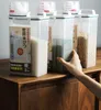 Barile di riso sigillato Scatola di immagazzinaggio a prova d'umidità Contenitore per la cucina domestica Serbatoio di plastica trasparente per cereali secchi con misurazione