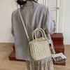 Lyxig designer väska strand halm kvinnlig mode nationell stil litteratur och konst tofs bucket fritid vävda bärbar axel handväska
