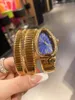 Armbandsur ankomst av högkvalitativa varumärken kvinnor tittar på att sälja mousserande handleds ormformade Watchwristwatches armbandsurturer