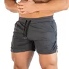 Män fitness bodybuilding shorts man sommarträning manlig andningsnät snabb torr sportkläder jogger strand korta byxor mäns w220331