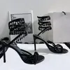 Sandali da donna di alta qualità Designer di lusso Ciondolo di luce di cristallo Anello del piede intrecciato Scarpe eleganti con tacco alto Fascia stretta Strass 10CM Sandalo da sera con tacco