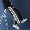 Męskie spodnie Mężczyźni luźne spodnie dresowe swobodny trening na guziki streetwear na guziki szeroką nogę 358men's Drak22