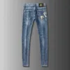 Lente Zomer Merk Jeans Mannen Elastische Koreaanse Versie Slim Fitting Voeten Gouden Paard Gedrukt Blauwe Broek