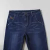 Jeans classici da uomo spessi autunno e inverno Pantaloni coreani business casual larghi a gamba dritta Pantaloni in denim stretch di marca maschile G0104