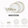 Naczynia talerze ceramiczne naczynie białą porcelanę i sałatkę zupa z zupą luksusowe obiad stołowy do restauracji dania