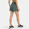 L-196 Shorts de sport décontractés pour femmes Pantalons courts de yoga à séchage rapide Pantalons de survêtement minces avec poches latérales Drop-In Élastique Fitness en plein air Pantalon à trois points