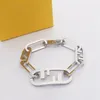 Berömda varumärkesdesigner Men Lady Women Titanium Steel Hollow Out Double F Letter 18K Guld tjock kedja Bangle Halsband Ear Studs Lyxiga smyckesuppsättningar HKJOP