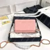 Luxe schoudertassen WOC Desigern Women Mini Handtas Nieuwe elegante schoudermessenger draagbare meisje kaviaar lederen zak portemonnee op ketting crossbody lychee patroon