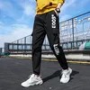 Mäns sidofickor last harem byxor band svart hip hop casual manliga joggare byxor mode streetwear 220325