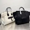 Klasyczna marka marki na płótnie torba zakupowa Kobietowa torebka o wysokiej pojemności mody luksusowy kolor stały kolor proste damskie torby na pojedynczy ramię