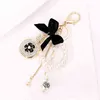 Fashion Imitation Pearl Perfume Bottle Keychain Car Key Ring Women Bag Charm Accessories Cute Bow Key Chain Creative Keyrings AA220318