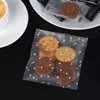 ギフトラップ100pcs 7cm透明なキャンディーバッグ結婚式の誕生日パーティー装飾用の透明なプラスチッククッキーOpp