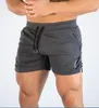 Shorts masculinos esportes musculares musculares de fitness de fitness de seca rápida praia de três pontos de fábrica de vendedores diretos