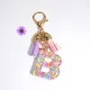 Engelska A-Z-alfabetet bokstäver Key Chain med TASSEL Glitter Keychains Inledande harts nyckelringskedjor Handväska hängande bilspegel