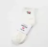 Chaussettes de créateur de marque japonaise, faites de sport avec broderie d'ours polaire, couleur unie, chaussettes courtes blanches absorbant l'humidité