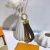 M65221 Dragonne Bag Holder Designer Floral Canvas keychain key -chain chain charm pochette accessoires name tag tag 293e267d261a
