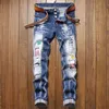 ユニセックスデザイナージーンズブランドZipper Pants for Men Joggers最新のヴィンテージタイプの膝パッチズボンは、販売中のバックポケットemodern888