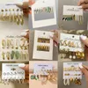 Dingle ljuskrona kreativt modemedels temperament kvinnors smycken fjäril tai chi färg akrylörhängen öronkrokar fest gåvor.