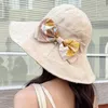 Sombreros de ala ancha Sombrero de sol de verano para mujer Gorra de sombra usable de doble cara Diseño de estampado de flores de moda Sombrero de playa de viaje para mujer al aire libreWide