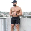 Мужские спортивные залы Fitness Loose Shorts Bodybuilding Joggers Summer Dry Dry Cool Short Pants Мужское повседневное пляжное бренд 220714