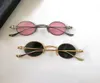 Gafas de sol modernas redondas ovaladas para mujeres Hombres Metal dorado Lentes gris oscuro Parasoles Protección UV Sonnenbrille gafa de sol con caja