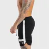 Fitness Sweatpants Shorts Man Summer Gyms Workout Male Breathable Mesh Quick dry Sportswear Jogger Beach Short Pants 220608