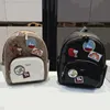 2022 Kou Family's New Double Shoulder Bags Womens Bag Meinius Essential PVC Splicing Backpack C Family Graffiti Single Shoulder Handbag