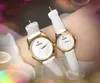 Crimen Pareja popular Mujeres Hombres Reloj 39 mm 32 mm Moda de lujo Mujeres Banda de cuero genuino Movimiento de cuarzo Reloj de pulsera de ocio Regalos de Navidad y San Valentín