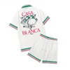 Casablanca-ss 2023 New Ping Pong Classic camicie da uomo stampa verde prateria Camicia di seta britannica allentata unisex manica corta designer tees magliette da spiaggia estive larghe da donna