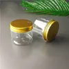 Transparente Aufbewahrungsboxen aus PET-Kunststoff. Lebensmitteltaugliche Verpackungsflasche, rundes, versiegeltes Glas mit goldenen Aluminiumdeckeln