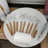 Ensemble d'ustensiles de cuisine en silicone 12 pièces avec support de poignées en bois pour ustensiles de cuisine antiadhésifs cuillère à soupe louche fouet fendu pince brosse serveur à pâtes