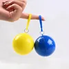 Engångs regnrock med plastkula täcker boll resor bärbara nyckelringbollar poncho akut engångs-hel färg regnkläder SN4574