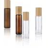Olio essenziale Roll On Bottle 5ml 10ml 15ml Bottiglie per campioni di profumo in vetro ricaricabili con sfera in acciaio inossidabile e contenitore con coperchio in bambù