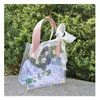 Sacchetto regalo in PVC sacca trasparente per matrimoni trasparente borse souvenir carine eleganti imballaggi di ritorno con impugnatura da fiore chic