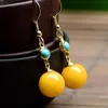 Bengelen kroonluchter ingelegd turquoise gele bijenwas bal lange dames oorbellen Chinese stijl charme licht luxe sieraden voor familieleden cadeausda