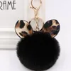 Schlüsselanhänger Winterexplosionen Leopardenschleife Plüsch-Schlüsselanhänger Kreative Pom-Schlüsselanhänger Pelzball-Taschenanhänger Pompom-Schlüsselanhänger Frauen FemaleKeychains Eme