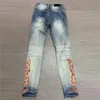 Jeans da uomo 2022 Trend arancione fuoco stampa Slim blu Hip Hop buco Vintage uomo Los Hombres pantaloni da moto streetwear
