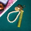 Keychain Clécherie de luxe Clées pendantes clés de boucle clés de boucle classique Fabric de tissus Perles 4 styles sacs porte-clés de haute qualité Orn9123675