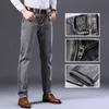 Mäns stretch Regular Fit Jeans Business Casual Classic Style Fashion Denim Trousers Male Black Blue Grey Pants 220328