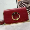 Blondie schoudertas lederen cross body canvas riem lederen bekleding katoen linnen voering ronde in elkaar grijpende designer luxe tassen