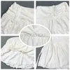 Хоучжоу сексуальная милая белая мини -юбка женская шнурки складка высокая талия нерегулярная пэчворка с оборками Fairycor