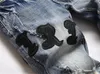 2023男子ペイジジーンズジーンズホンブレレタースター刺繍パッチワークは、トレンドのためにリッピングされたオートバイパンツメンズスキニー