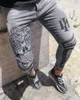 2022 men's jeans stretch high quality designer skull denim pencil pants hip hop zipper slim tall elastic thin printing gray sports jeans for men