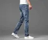 Family Am Light Luxury Hong Kong Marca de moda de ponta de jeans masculino Lazer juvenil Slim Elastic algodão elástico Calças perfuradas