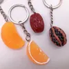 Nyckelringar söta simulering nötter frukt orange nyckelring trinket enkel mat charms kvinnor flickor väska hängsmycken biltillbehör Keyring Enek