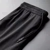 Sports Pants Mens Quickdrying Ice Silk Breathable Ninepoint Summer Thin Running Fitness Loose Mesh Airconditioning Trousers 220621